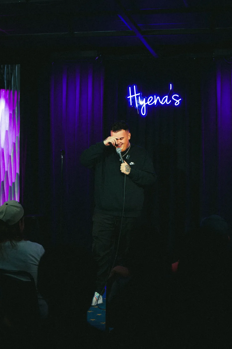 AJ Deleon on stage, Hyena's Comedy Club